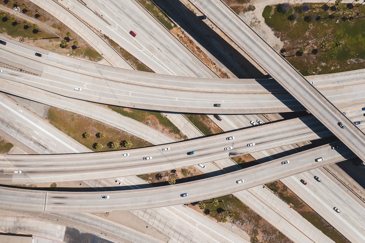 Aerial shot of a multi-level highway interchange showcasing urban traffic patterns.